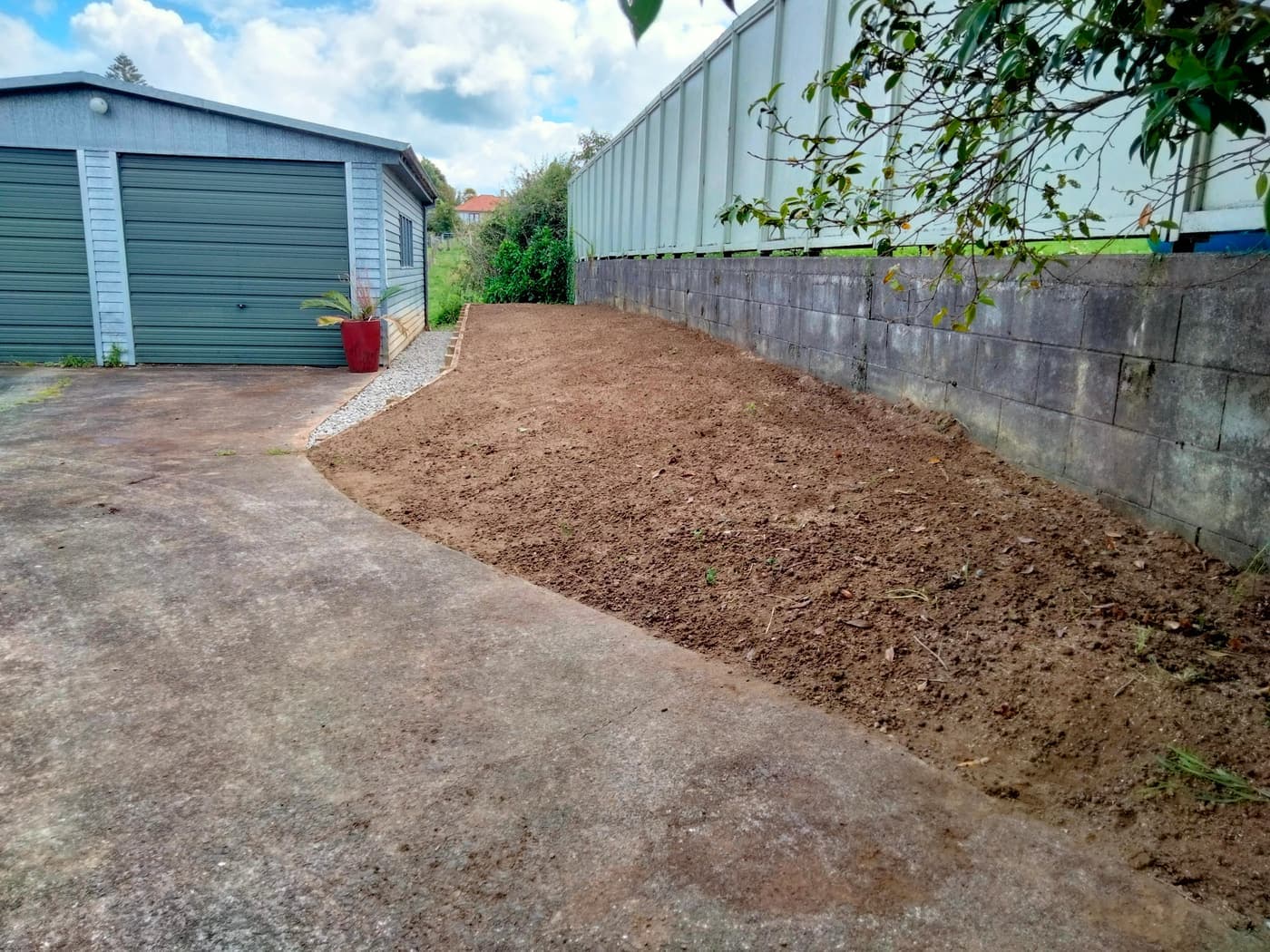 Garden bed prepared along wall (before planting)